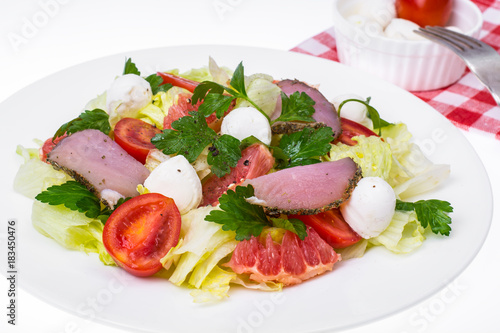 fresh vegetable salad with ham and mozzarella