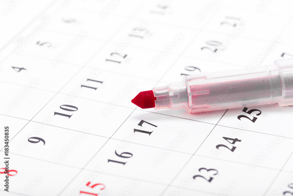 Check out the dates in a business calendar concept Check out the dates in a business calendar concept