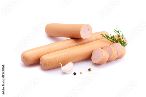 Frankfurter sausage isolated on white background with herbs and peppercorns