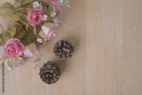 flower decoration on wood table with panel banner with copy space.