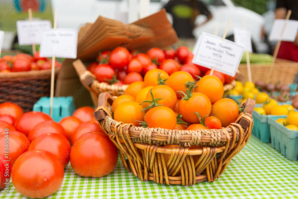Organic red and golden tomatoes at farmers' market. Organic red and golden tomatoes at farmers' market.
