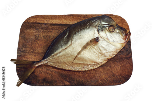 Smoked moonfish on cutting board isolated with clipping path photo