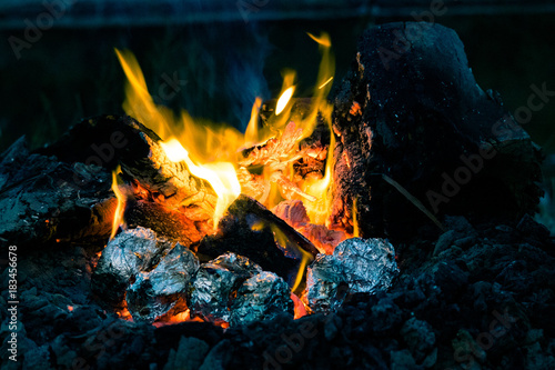 Potatoes cooking on a wood fire