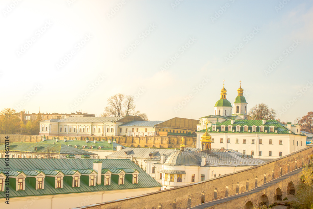 Naklejka premium Panoramic view of the distant and near caves of Kiev Pechersk Lavra monastery in Kiev, Ukraine. Kiev-Pechersk Lavra. Color toning. Old photo style.