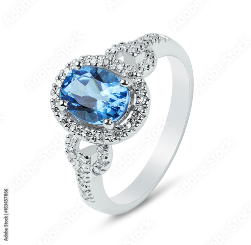 Diamond ring. Diamond ring with topaz isolated on white background. Ring with diamonds and large topaz.