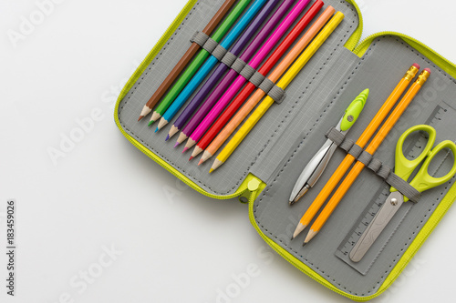 Photography Open pencil case on white background