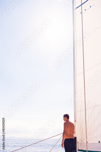 Young Man On Sailboat © nullplus