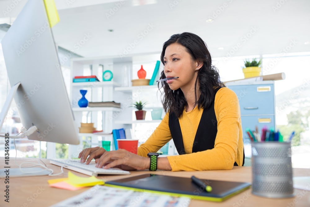 Female executive working on computer Female executive working on computer