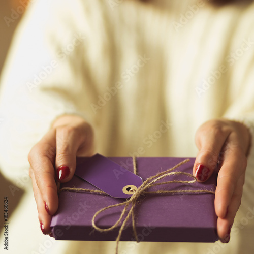 Woman giving christmas gift
