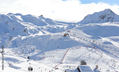 Alpine ski slope in sunny weather