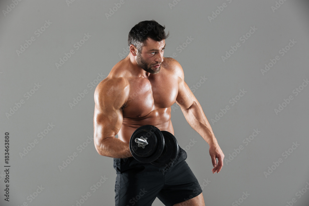 Portrait of a fit strong shirtless male bodybuilder