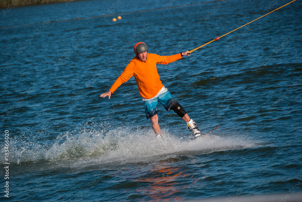 Enthusiastic man riding a wakeboard