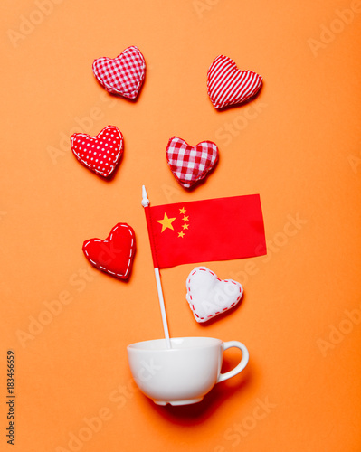 White cup and heart shapes with China flag