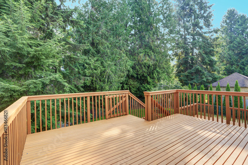 Empty walkout deck with redwood railings