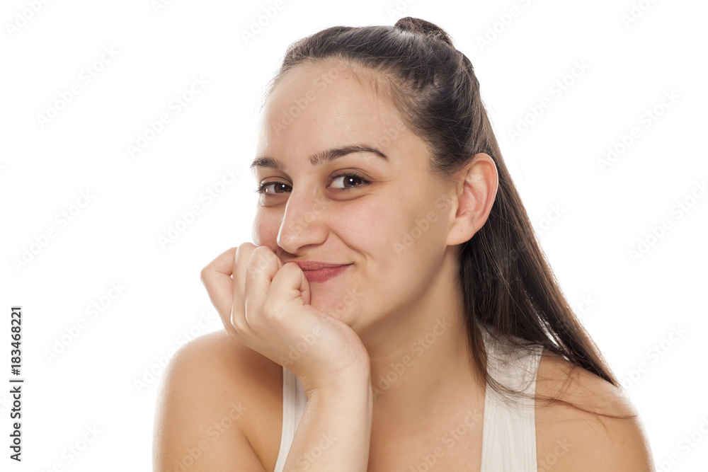 a young, pretty woman with a shy smile a young, pretty woman with a shy smile