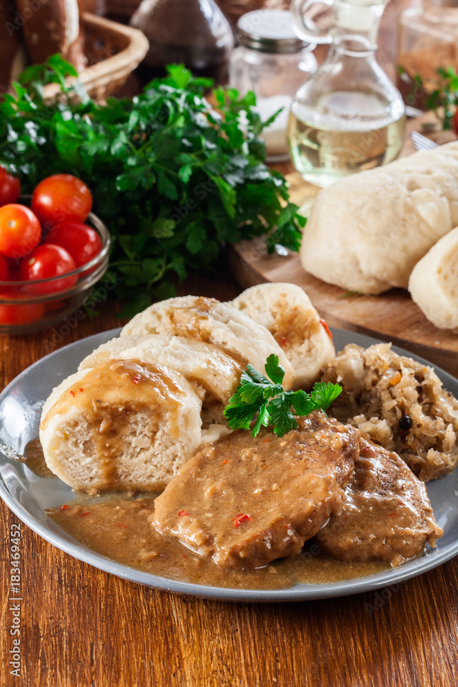 Pork loin in gravy with bread dumplings and sauerkraut Pork loin in gravy with bread dumplings and sauerkraut