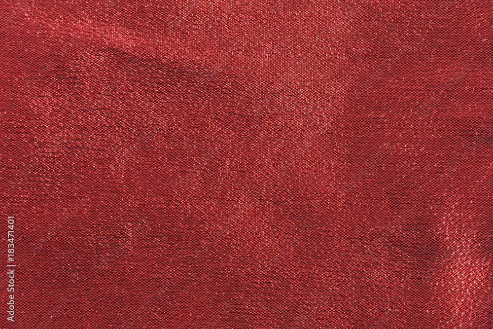 Close view of red metallic woven cloth.