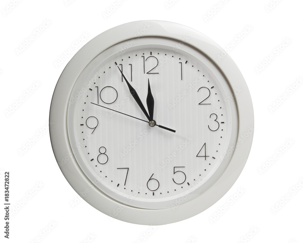 Five minutes to twelve - Closeup of hands on wall clock face Five minutes to twelve - Closeup of hands on wall clock face