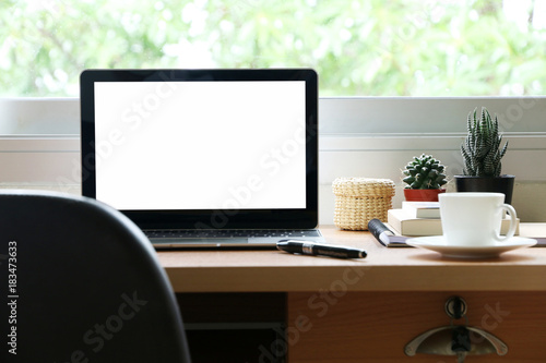 blank screen laptop on the desk at home office 