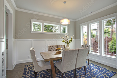 Elegant transitional dining room with board and batten walls