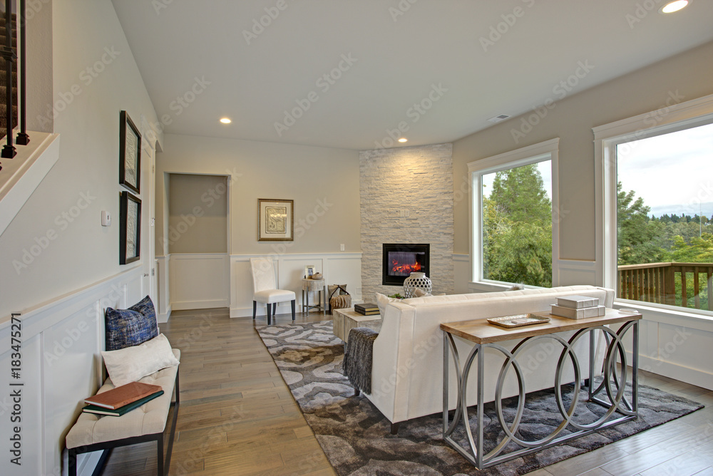 Luxury living room features corner stone fireplace Luxury living room features corner stone fireplace