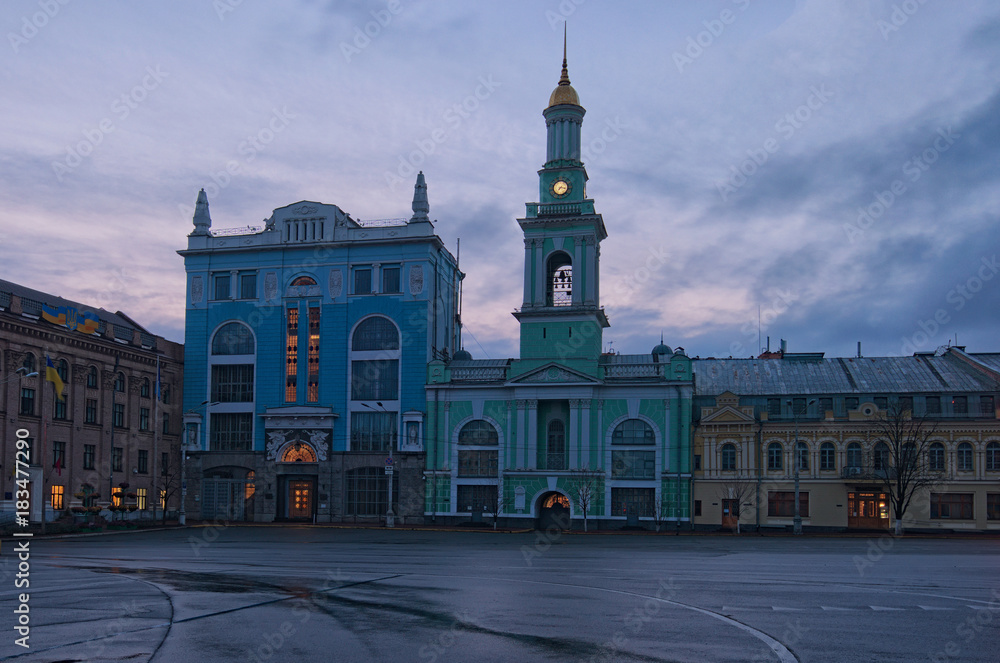 Square of Contracts (Kontraktova Square) in Kyiv. Ukraine. The former Greek Monastery on the square. The building currently hosts the city branch of the National Bank. Early morning view