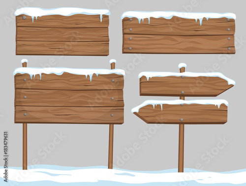 Vector cartoon set of blank wooden signs covered with snow and ice isolated on grey background