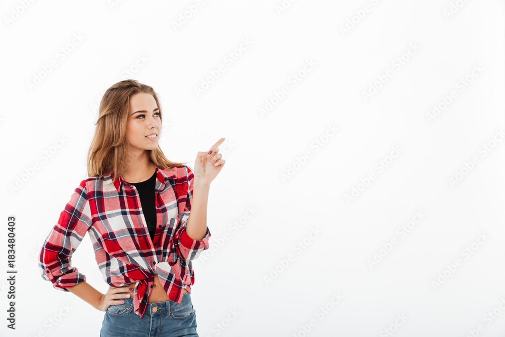 Portrait of a young lovely girl in plaid shirt standing Portrait of a young lovely girl in plaid shirt standing