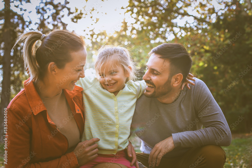 Fototapeta premium Love you mom and dad. Little girl with parent.