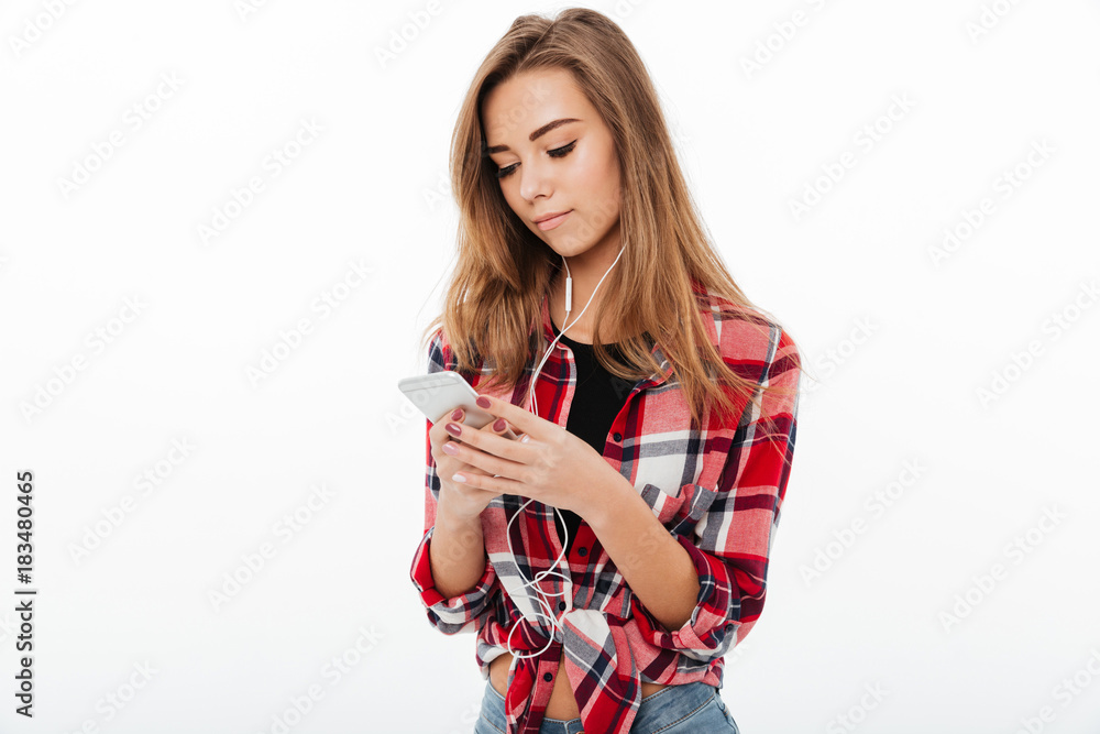 Naklejka premium Portrait of a lovely pretty girl in plaid shirt
