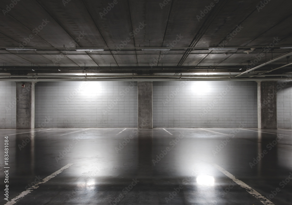 Naklejka premium Empty parking lot at underground floor of shopping center more parking lot for customer convenient.