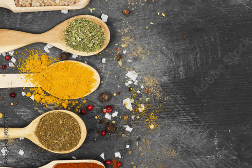 Various spices on a black background. Top view, copy space. Food background