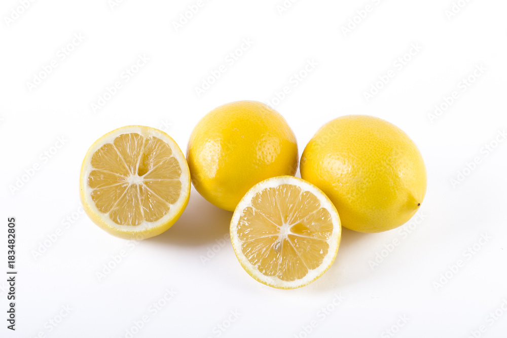 Lemons with leaves on a white background. Fresh lemons on a white background. Lemons with leaves on a white background. Fresh lemons on a white background.