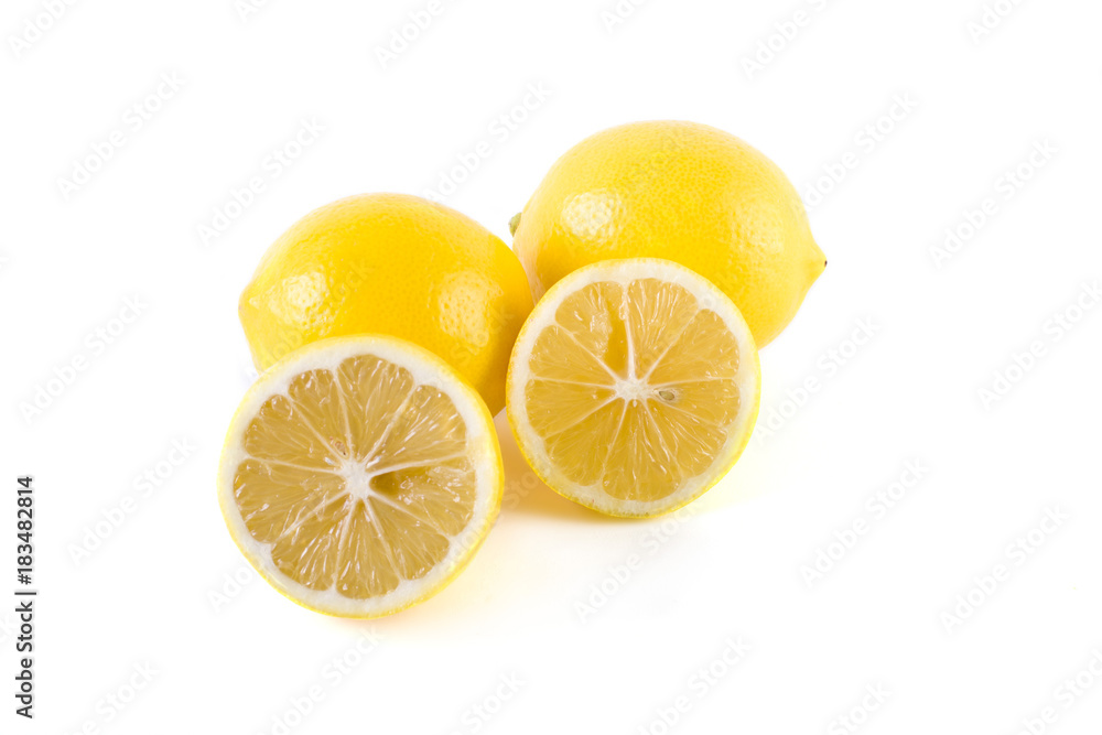 Lemons with leaves on a white background. Fresh lemons on a white background.