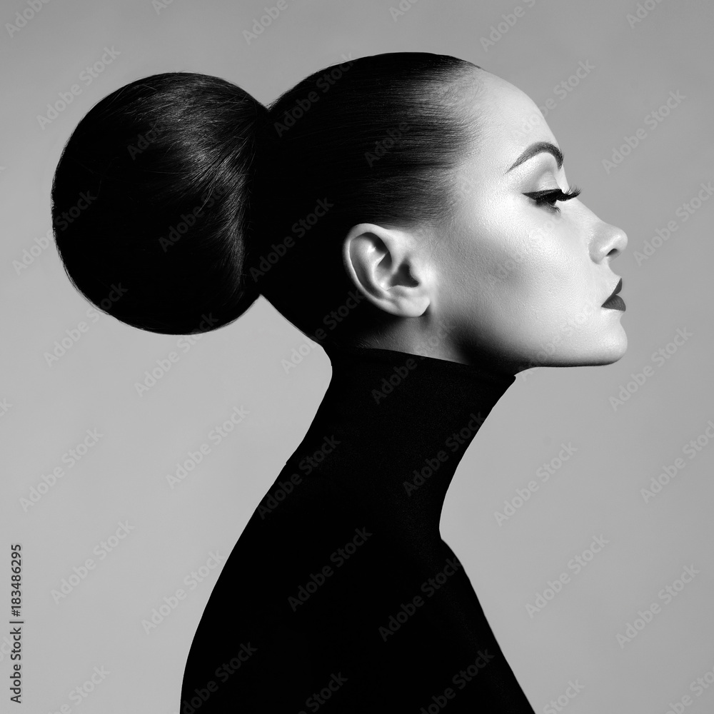 Fototapeta Beautiful elegant woman in black turtleneck