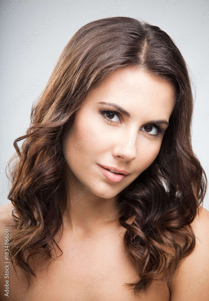 Portrait of beautiful woman, over grey Portrait of beautiful woman, over grey