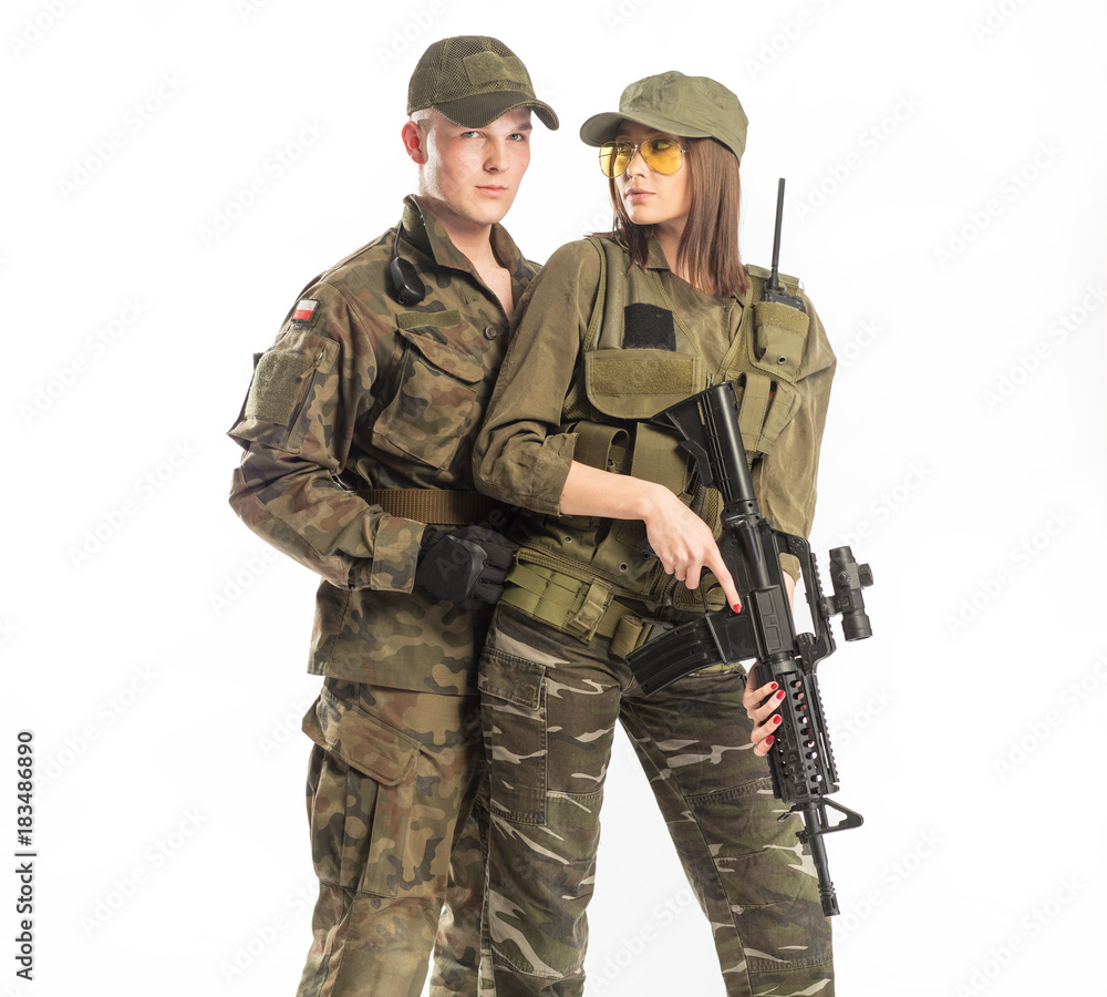Man and woman in solider's suit on white background.
