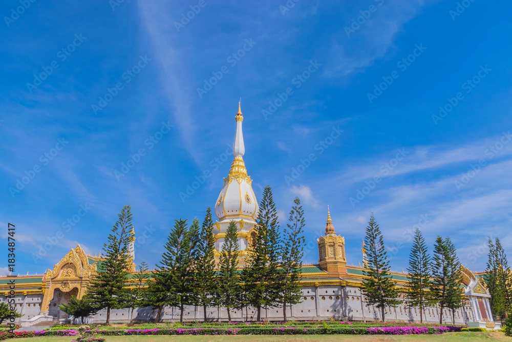 Naklejka premium The sanctuary at Wat Phra Maha Chedi Chai Mongkol ,Roi Et province, Thailand with the beautiful sky and cloud.The public properties.