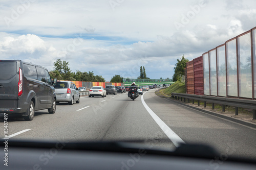 Driving a car on the highway in good weather conditions