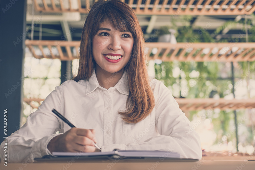 start up woman work in cafe. female student write note in notebook in coffee shop. education, lifestyle, business, people concept. start up woman work in cafe. female student write note in notebook in coffee shop. education, lifestyle, business, people concept.