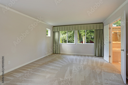 Empty room with carpet floor and grey walls