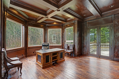 Tableau sur toile Chic Wood Paneled Home office features coffered ceiling