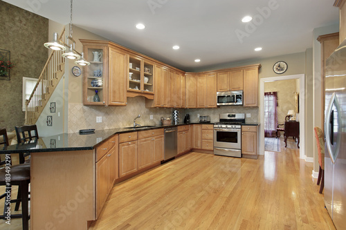 Kitchen with long granite counter