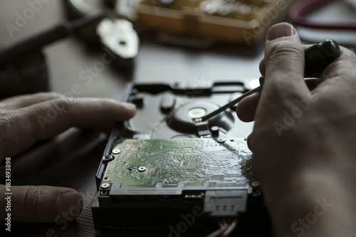 Hands repair hard drive