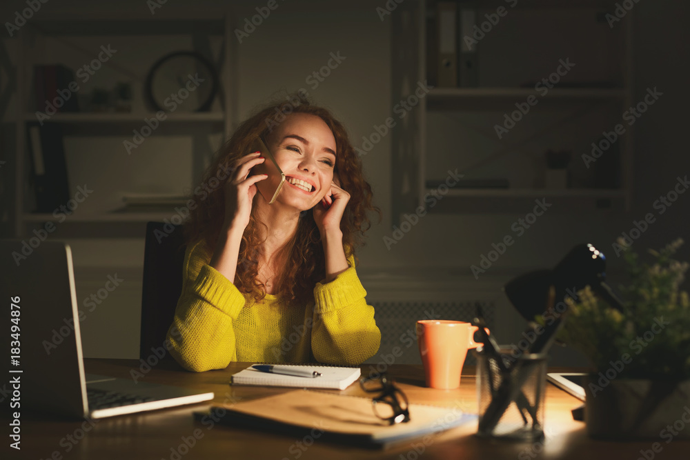 Smiling woman at work talking on phone Smiling woman at work talking on phone