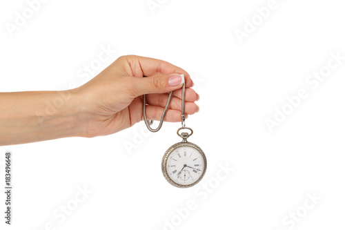 Hand of woman holds pocket clock, isolated