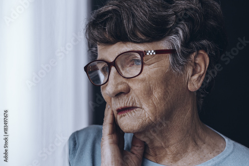 Elderly woman s face with glasses