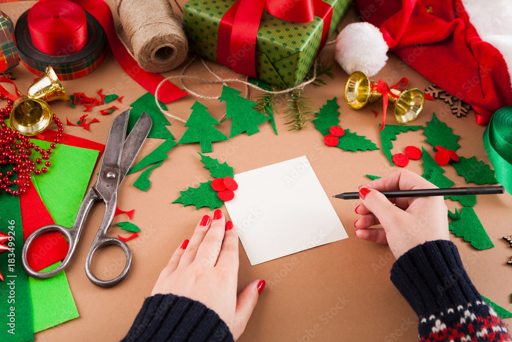 Creative diy hobby. Christmas decoration of handmade greetings card