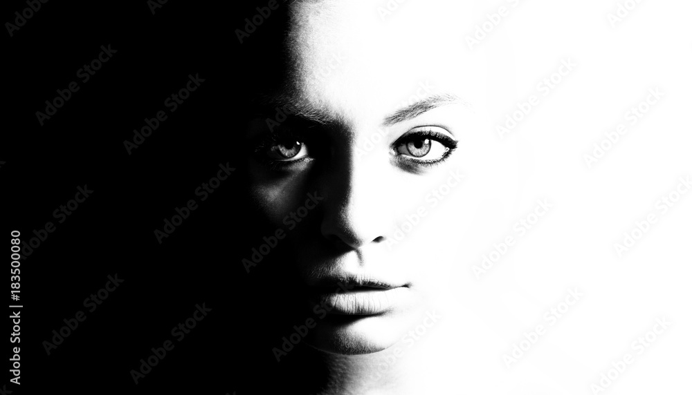 Fototapeta premium High contrast black and white portrait of a beautiful girl.