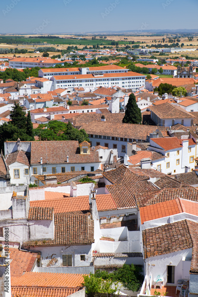 Naklejka premium The view of city residential houses which surround the Cathedral (Se) of Evora. Portugal